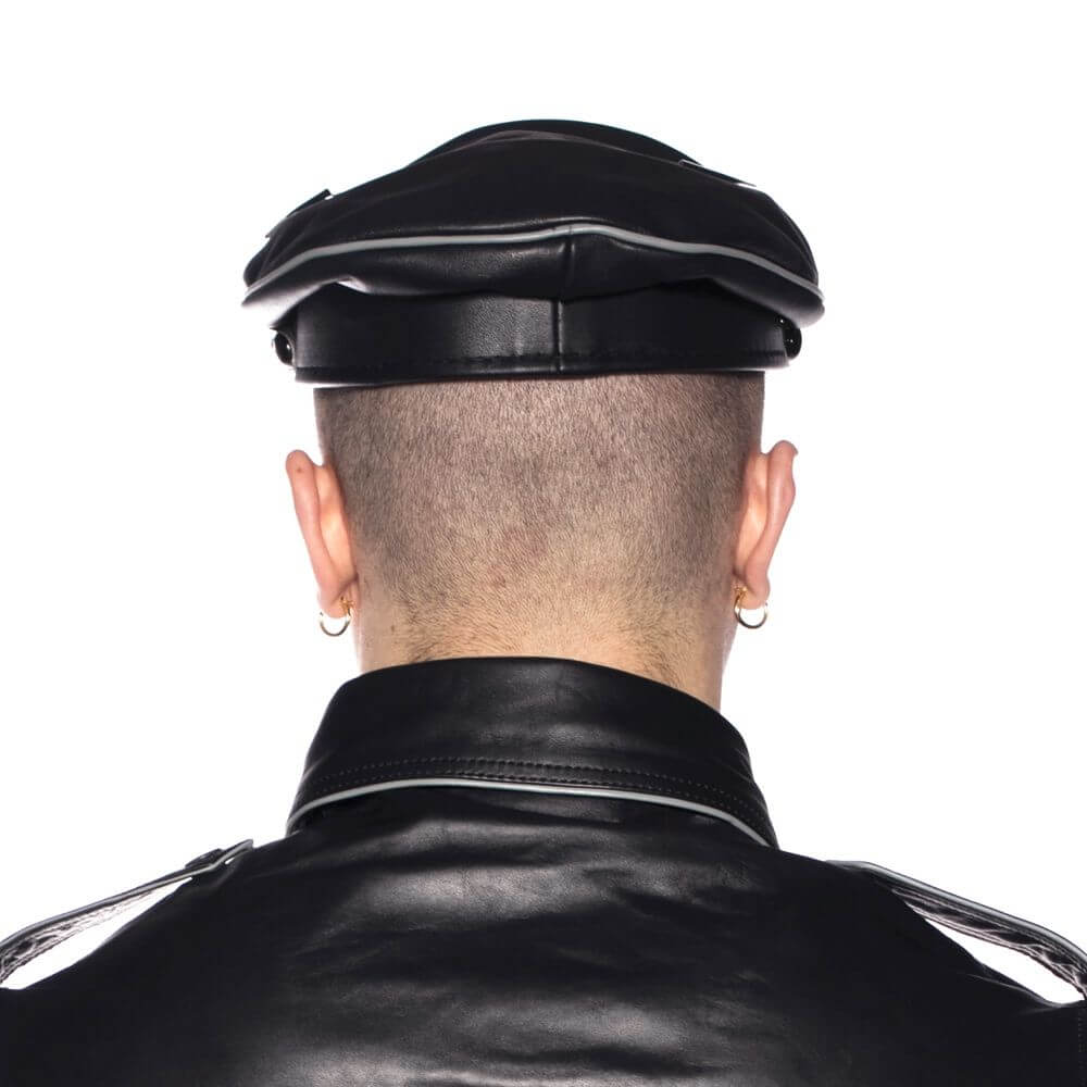 Back view of a person wearing a Prowler RED Military Cap Grey Large 59cm and a black leather jacket.