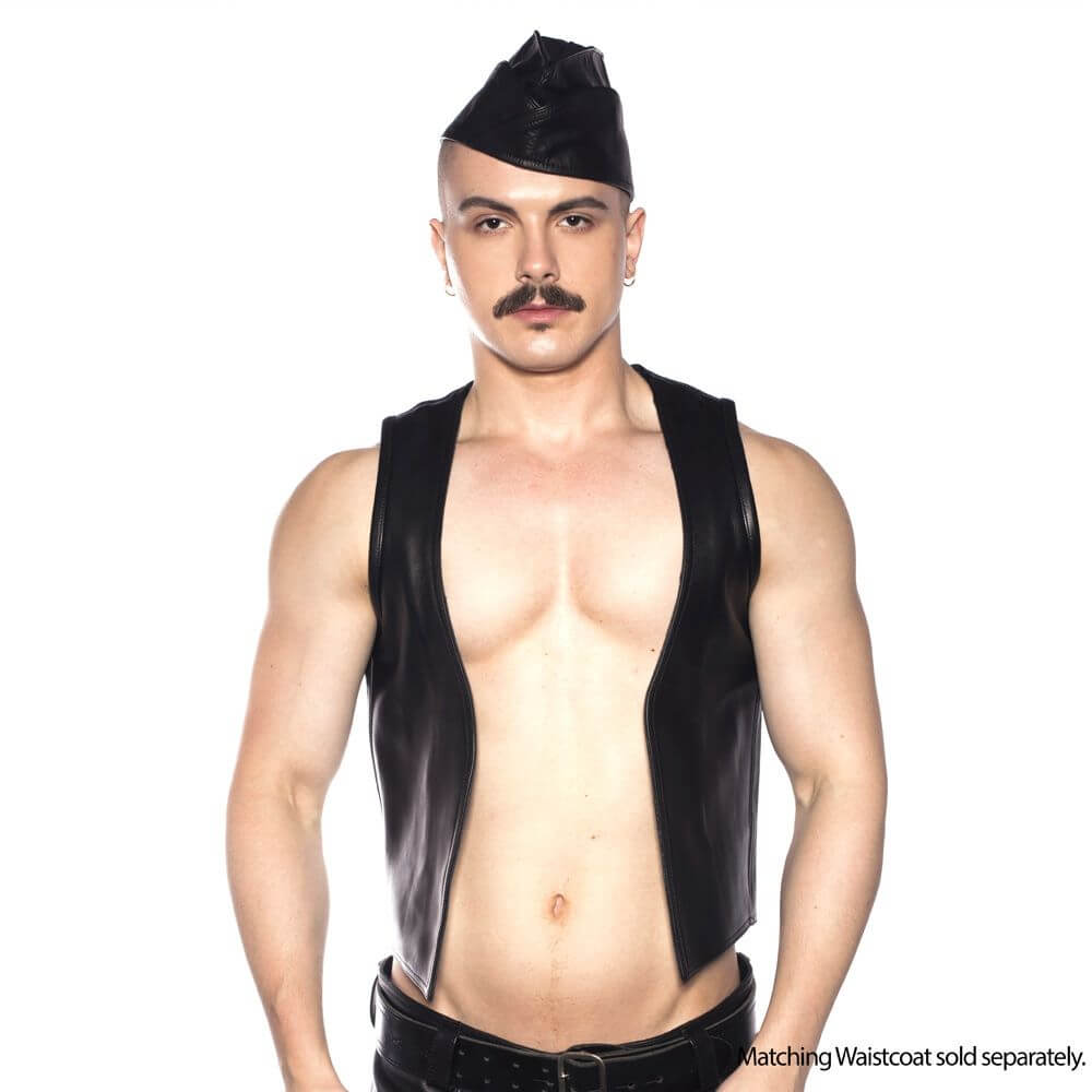 Prowler Red Triangle Cap Black 55 cm Small worn with a leather vest, showcasing a bold fetish style.