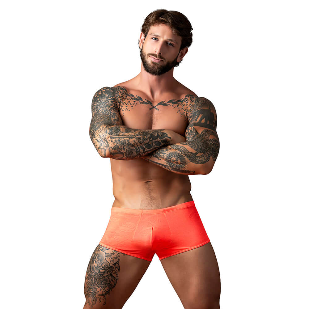 Male Power Kilauea Limited Edition Mini Short Coral L model showcasing vibrant coral color and athletic fit.
