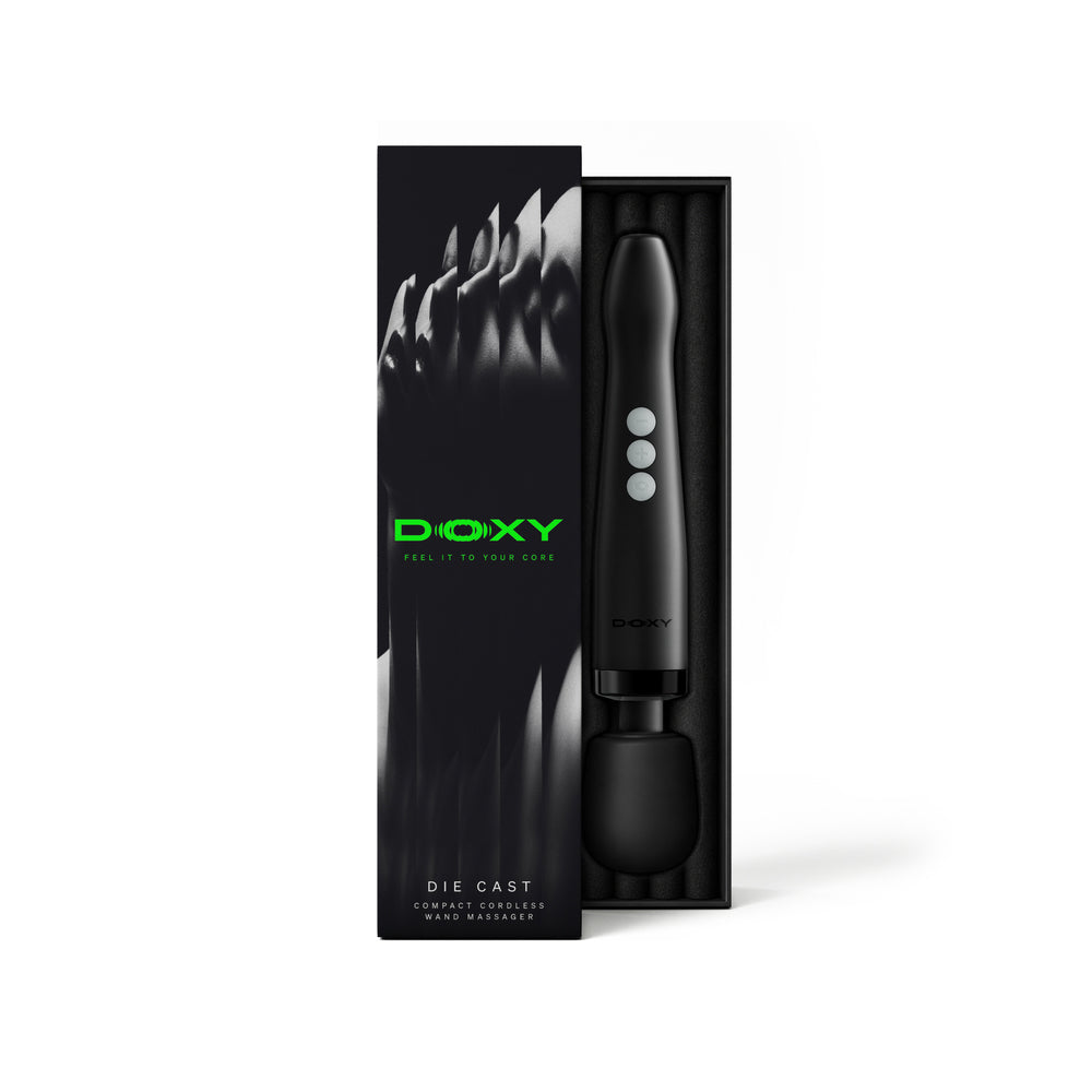 Doxy Die Cast Compact Cordless Wand Black in packaging, showcasing its sleek design and premium features.