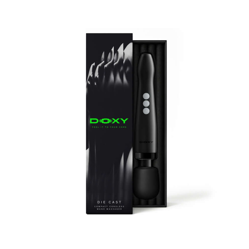 Doxy Die Cast Compact Cordless Wand Black in packaging, showcasing its sleek design and premium features.