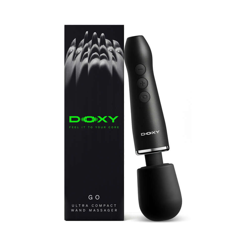 Doxy Go Travel-sized Wand Massager Black next to its packaging, showcasing a sleek, ultra compact design.