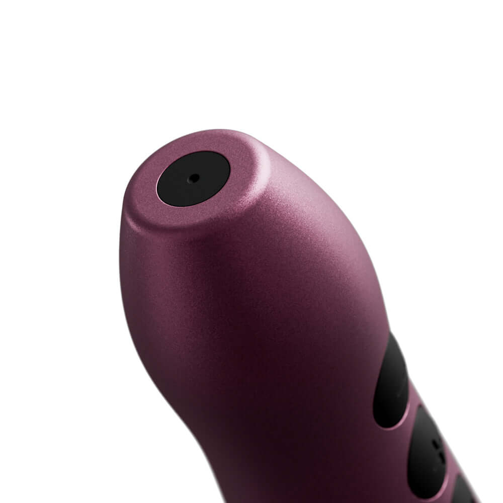 Doxy Go Travel-sized Wand Massager Pink close-up view showcasing its compact design and anodized aluminum finish.