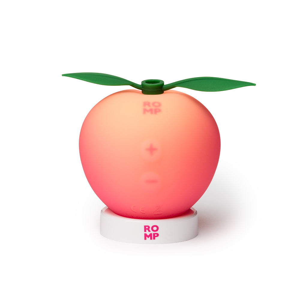Romp Pink Peach Air Suction Clitoral Stimulator featuring a playful peach design and ergonomic shape.