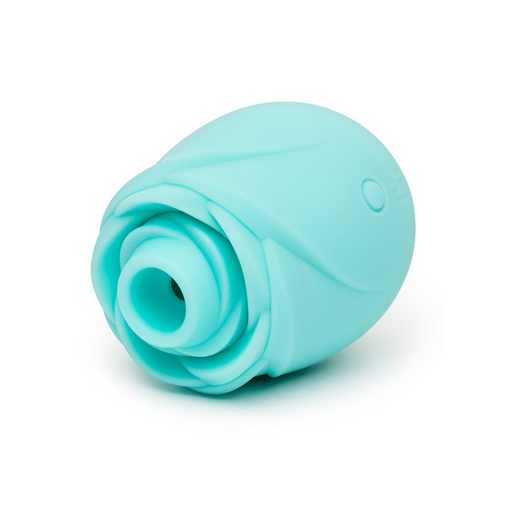 Romp Glow Air Suction Rose Massager in a soft blue silicone rose-inspired design for external stimulation.