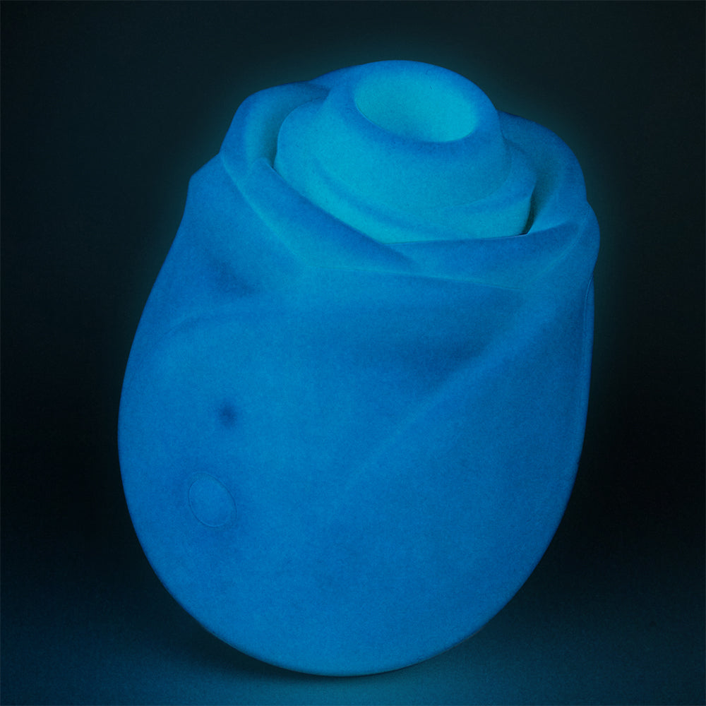Romp Glow Air Suction Rose Massager in a glowing blue rose design, showcasing elegant styling and innovative technology.