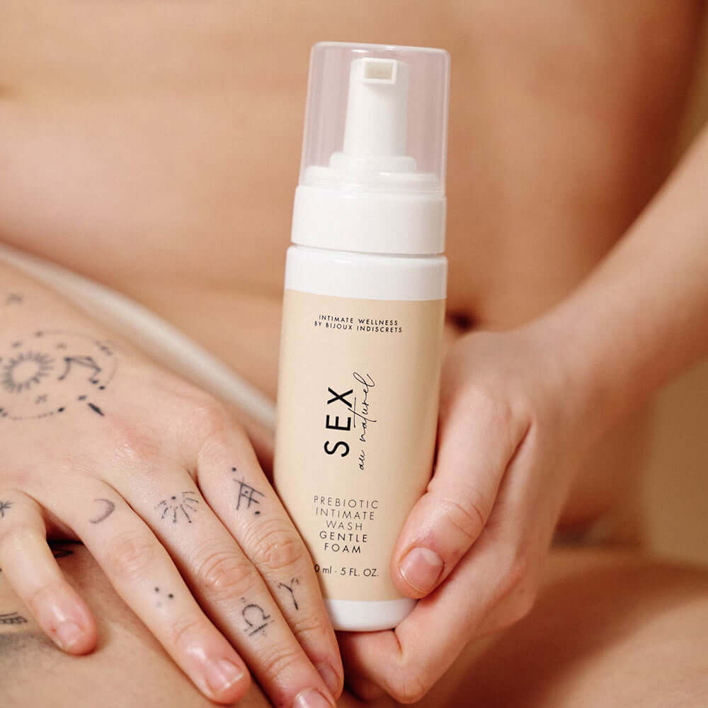 Sex Au Naturel Prebiotic Intimate Wash Gentle Foam held in hands, promoting gentle care for delicate skin.