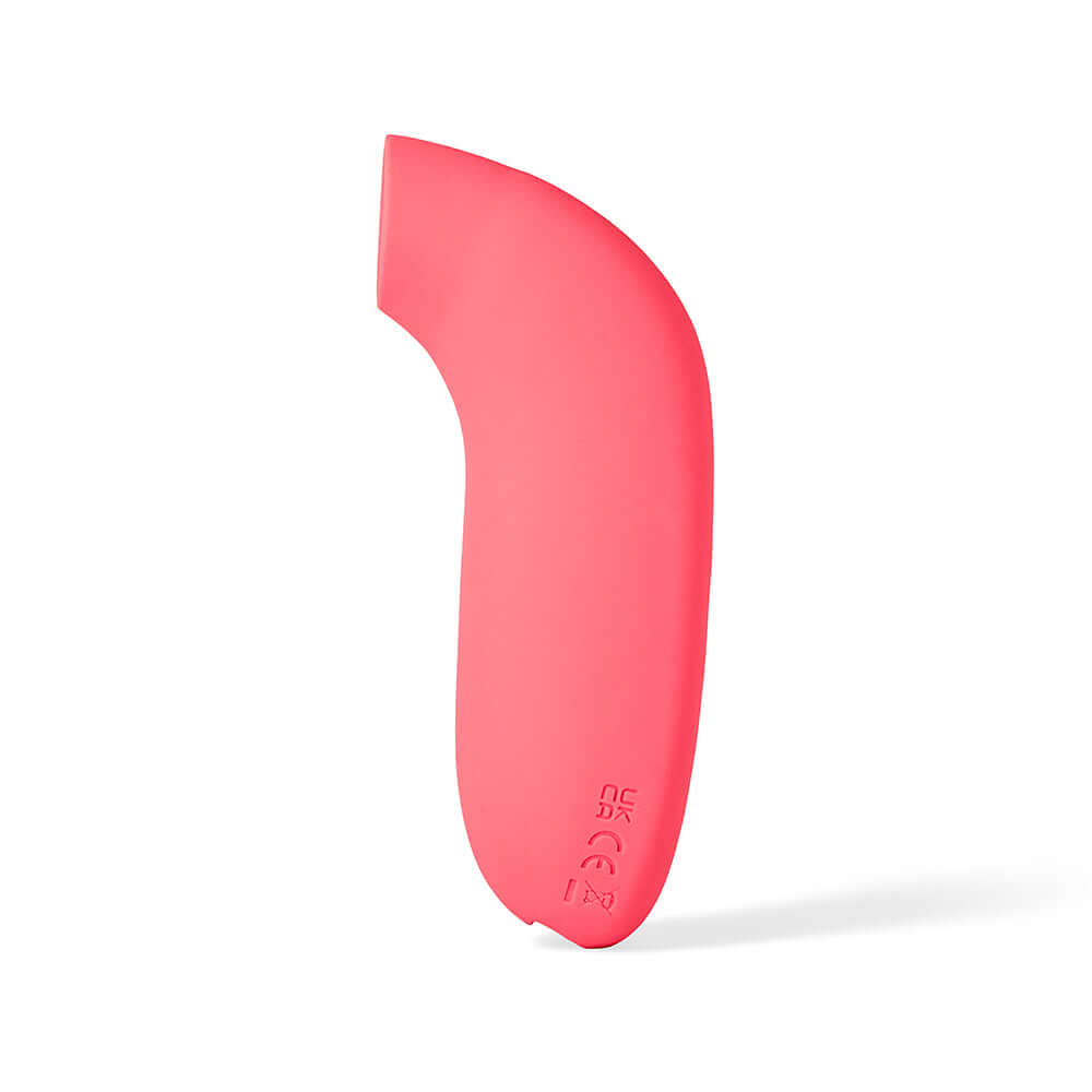 Dame Aer Suction Massager Coral in a vibrant coral color, featuring an innovative design for self-pleasure.