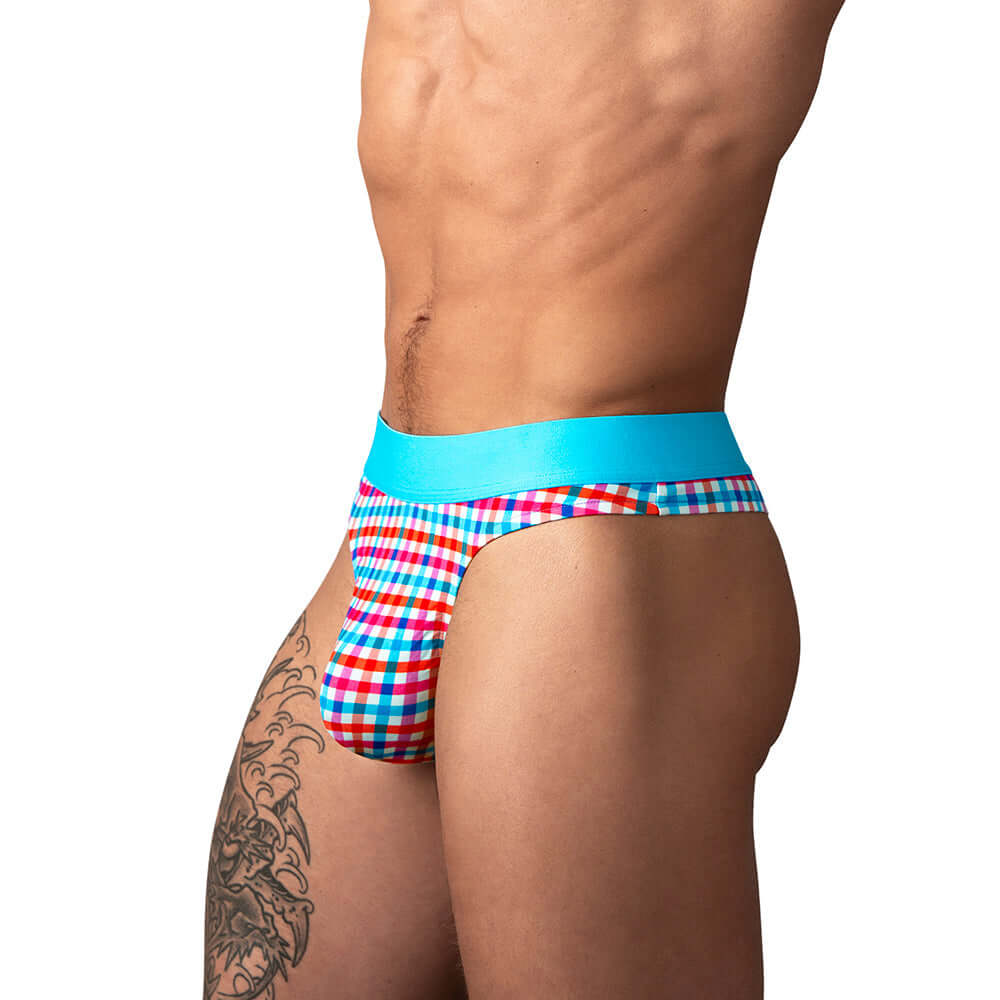 Male Power So Cumfy Gingham Thong Turquoise S M showcased on model, featuring vibrant gingham design and comfort fit.