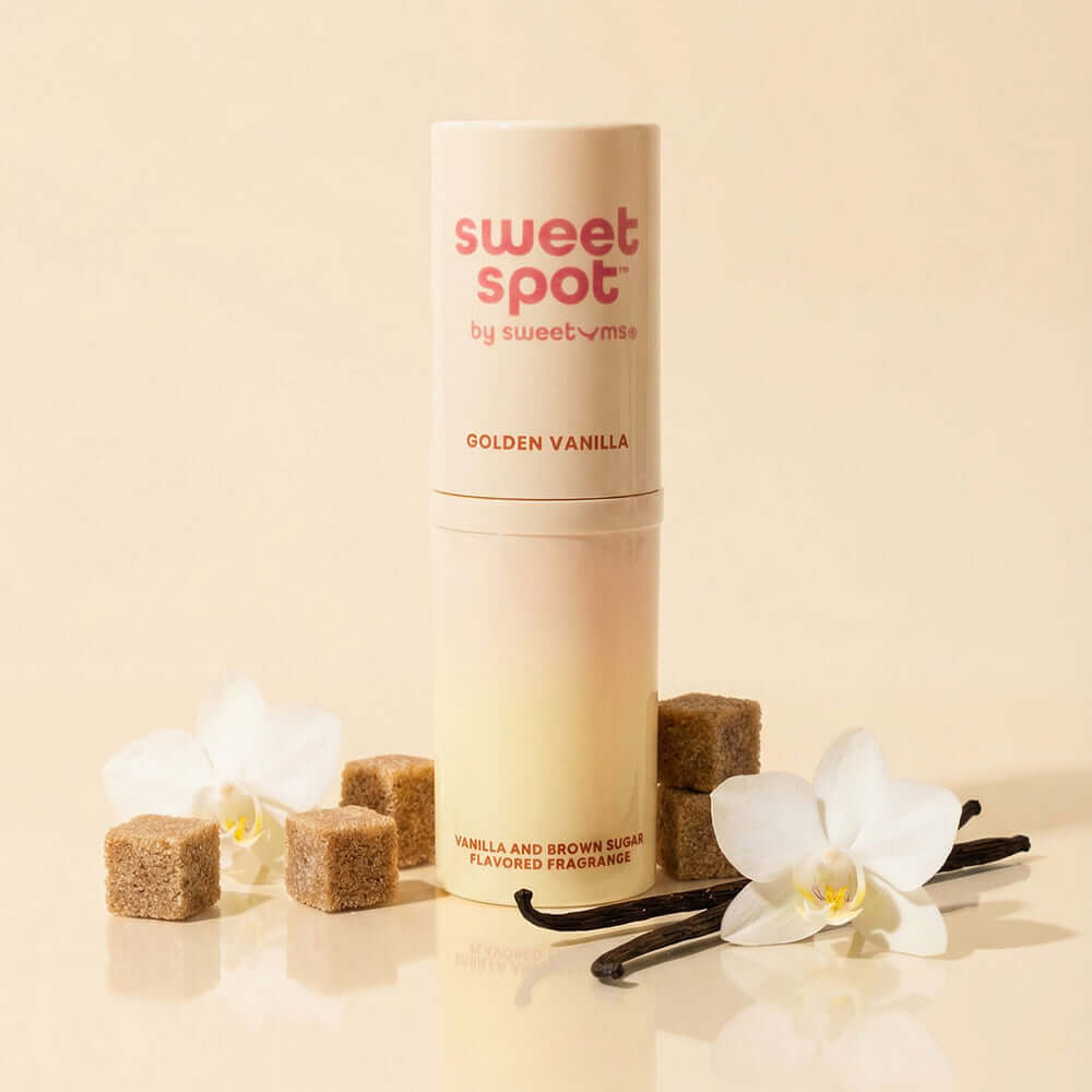 Sweetums Sweet Spot Flavored Fragrance Golden Vanilla with floral elements and sugar cubes.