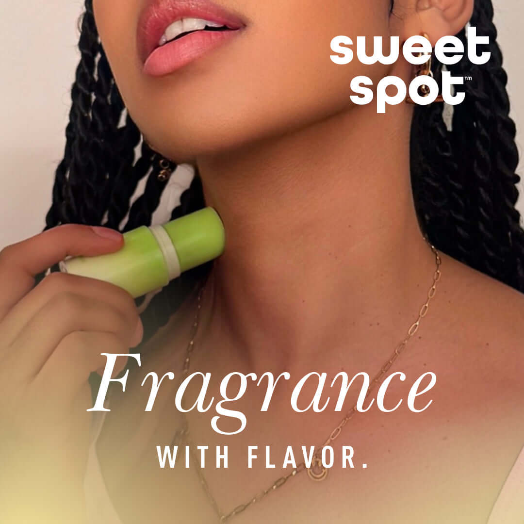 Sweetums Sweet Spot Fragrance Pineapple Coconut Crush solid fragrance stick applied to neck, showcasing tropical vibes.