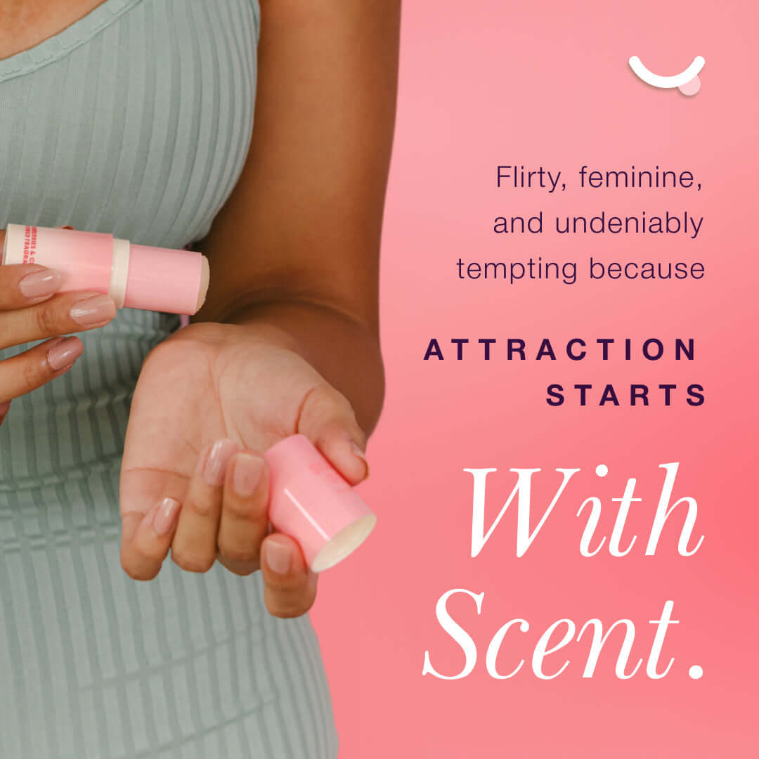 Sweetums Sweet Spot Fragrance Pineapple Coconut Crush solid fragrance stick held in hands, promoting scents for attraction.