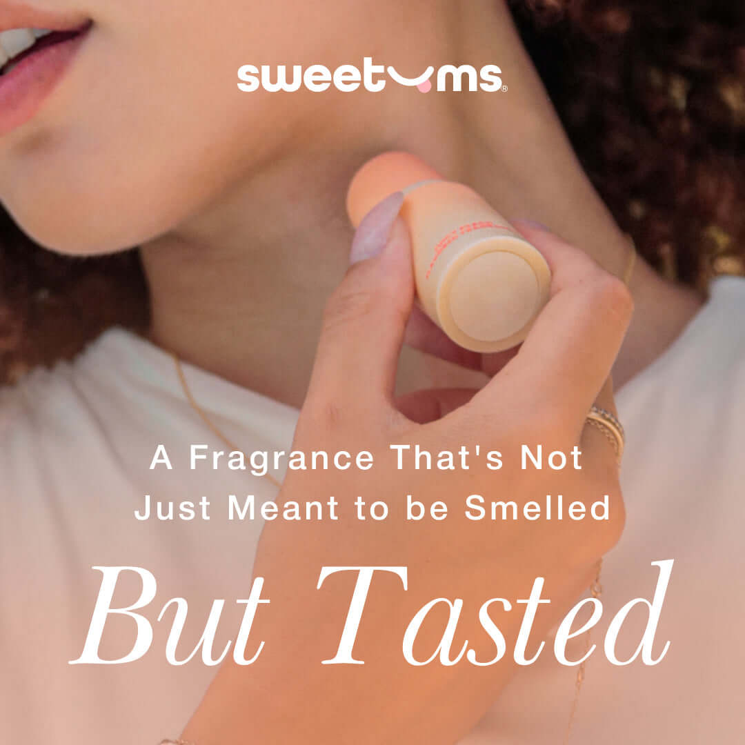 Sweetums Sweet Spot Fragrance Pineapple Coconut Crush applied on skin for a delicious tropical scent experience.