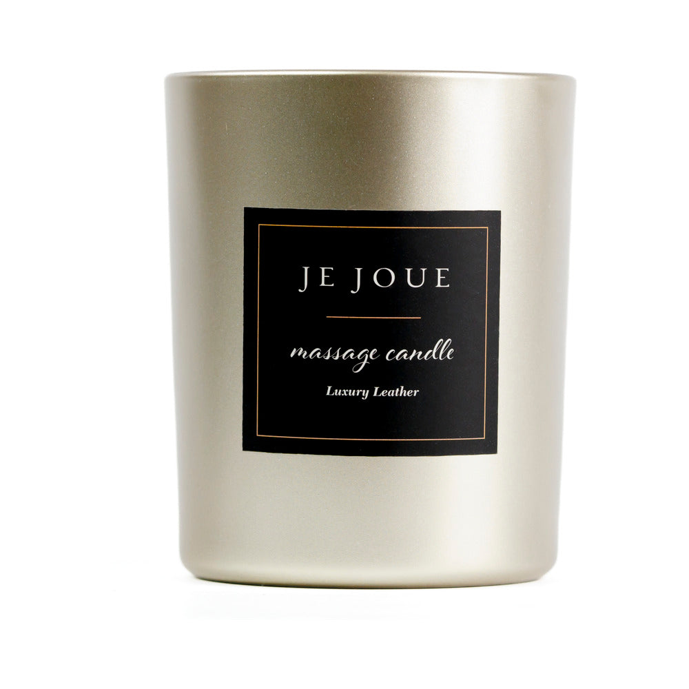 Je Joue Luxury Leather Massage Candle 160g in an elegant gold holder, perfect for a sensual evening.