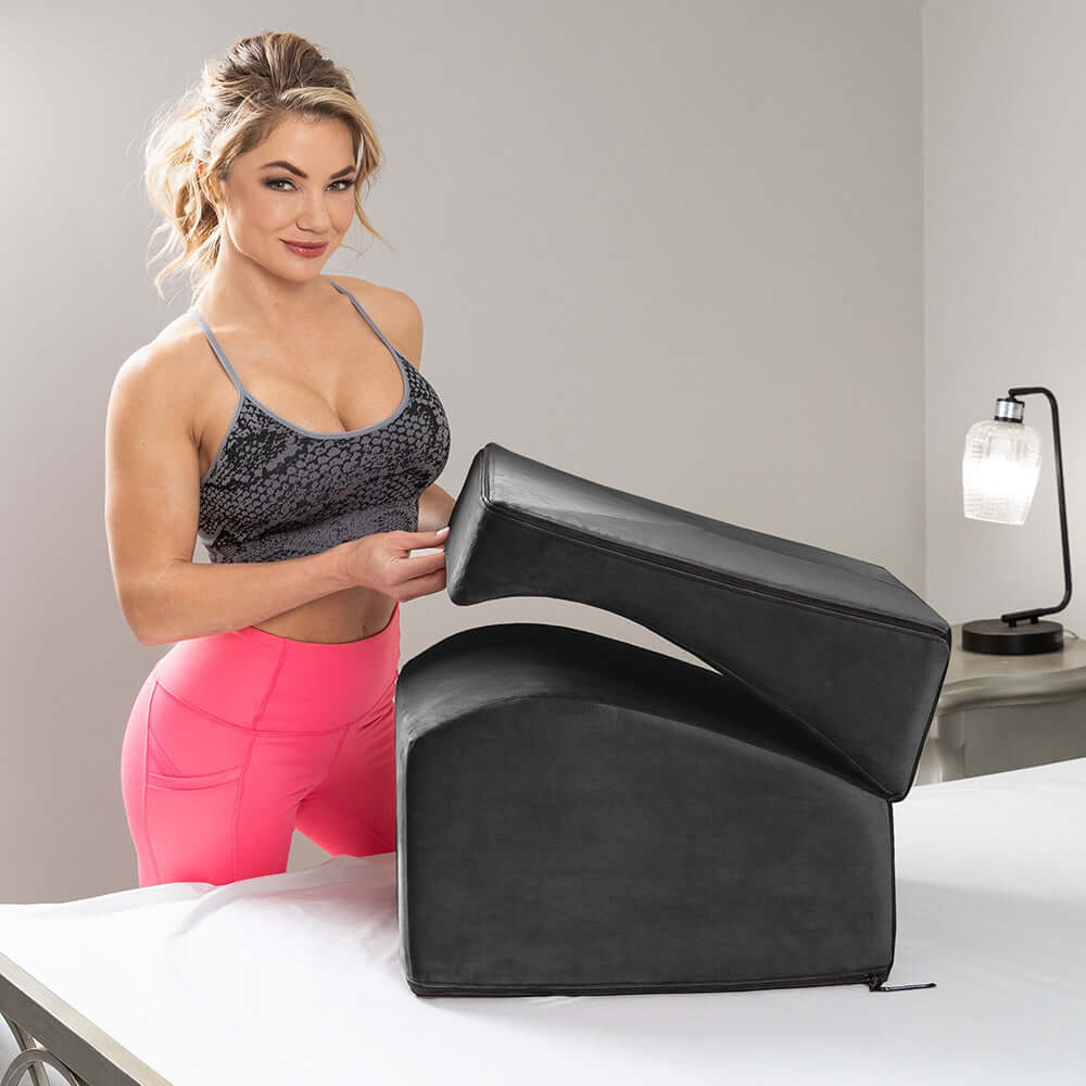 Liberator Flip Ramp With Slip Cover Lush Black displayed with a person demonstrating its use in a stylish setting.