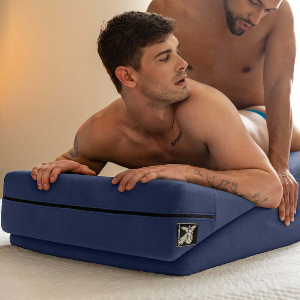 Liberator Wedge & Ramp Sex Combo Original Size Blue in use by two men during intimate moments.