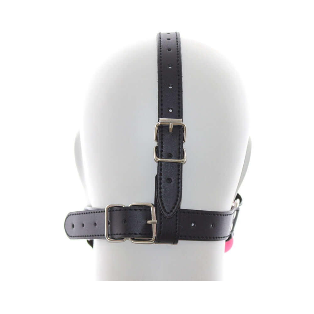 Back view of the Ple'sur Face Harness Ball Gag Pink showcasing its adjustable straps and secure fit.