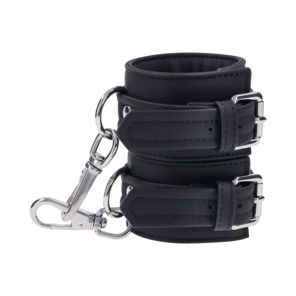 Sportsheets Signature Midnight Muse Handcuffs featuring soft silicone material and sleek silver hardware for refined restraint play.