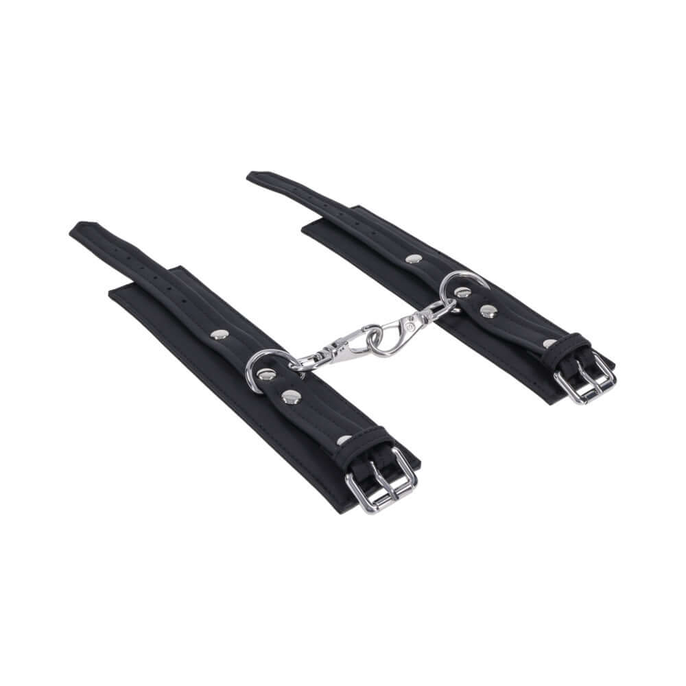 Sportsheets Signature Midnight Muse Handcuffs with soft silicone and sleek silver hardware for refined restraint play.