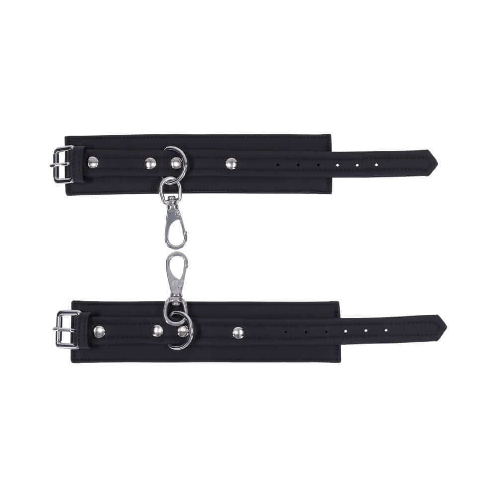 Sportsheets Signature Midnight Muse Handcuffs with soft silicone and silver hardware for refined restraint play.