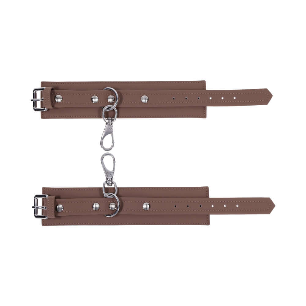 Sportsheets Signature Dawn Dream Handcuffs featuring soft silicone and sleek silver hardware for comfortable restraint play.