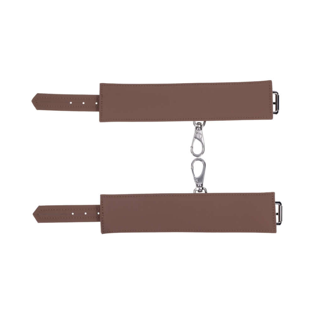 Sportsheets Signature Dawn Dream Handcuffs featuring soft silicone with silver hardware for comfortable restraint play.