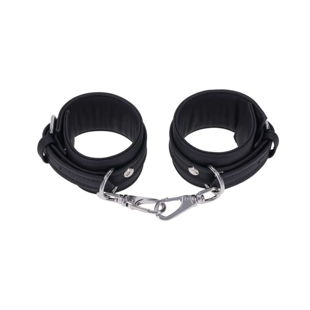 Sportsheets Signature Midnight Muse Ankle Cuffs featuring soft silicone and sleek silver-tone hardware for stylish restraint play.