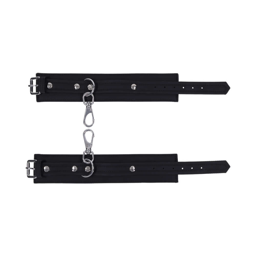 Sportsheets Signature Midnight Muse Ankle Cuffs featuring sleek black silicone and silver-tone hardware.