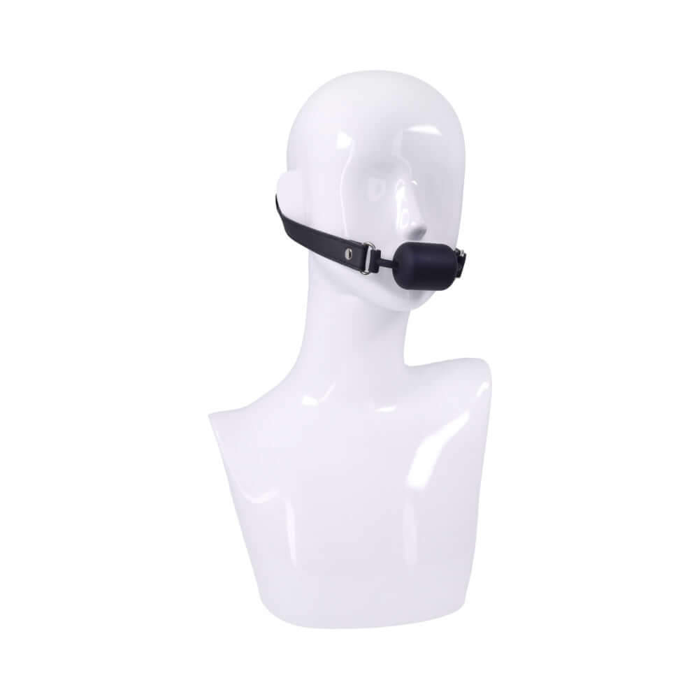 Sportsheets Signature Midnight Muse Barrel Gag on a mannequin head, showcasing its sleek design and luxurious look.