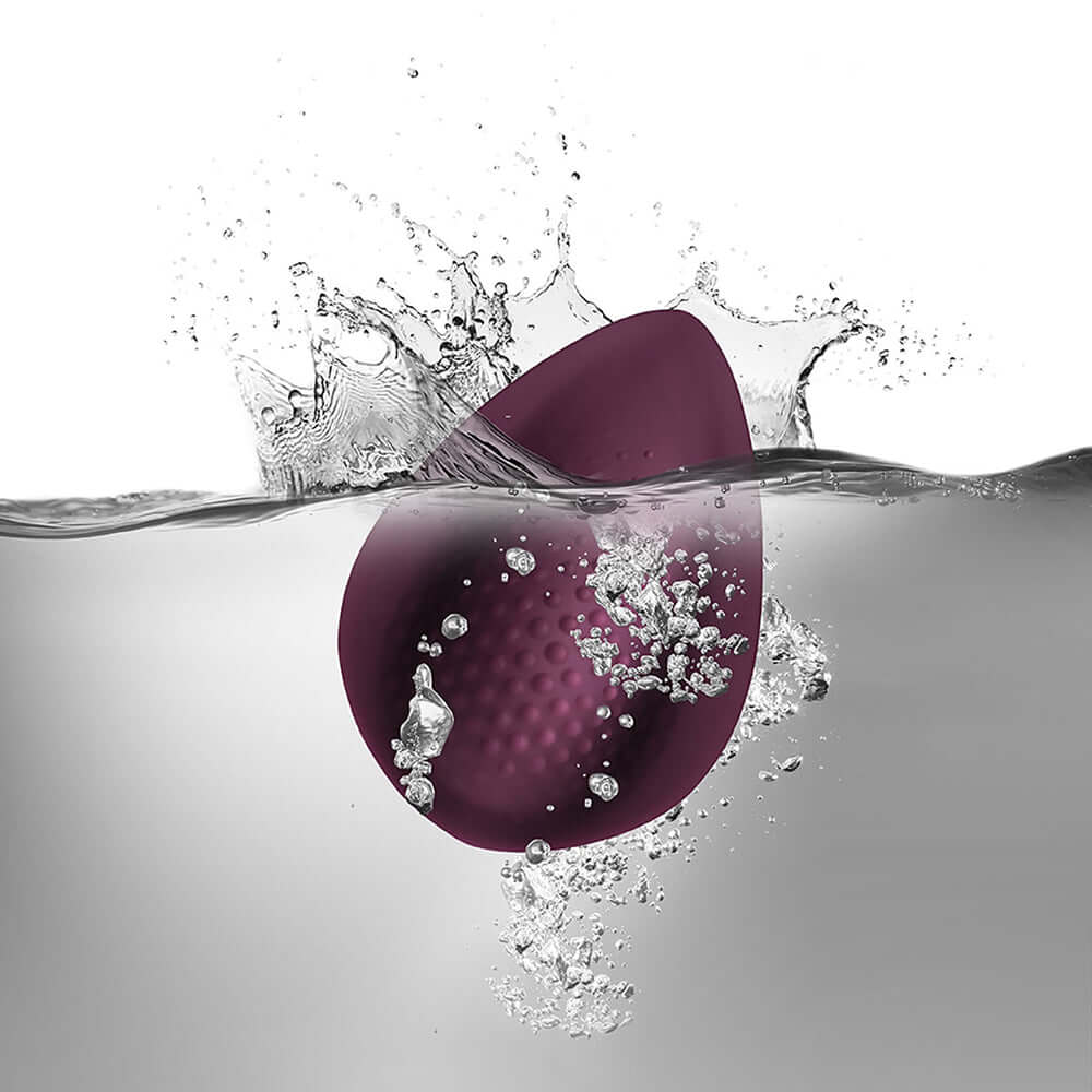 Knickerbocker Glory Panty Vibe Burgundy submerged in water, showcasing its waterproof design and sleek appearance.