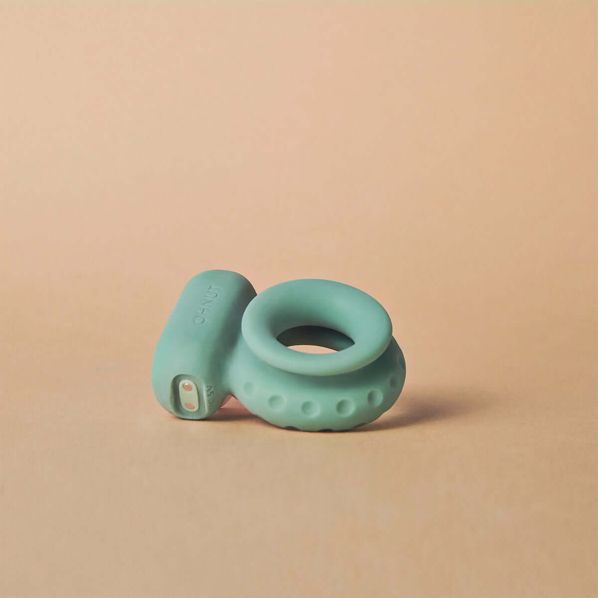 Ohnut Vibrating Ring Jade showcasing its soft and stretchy design, perfect for hands-free pleasure and comfort.