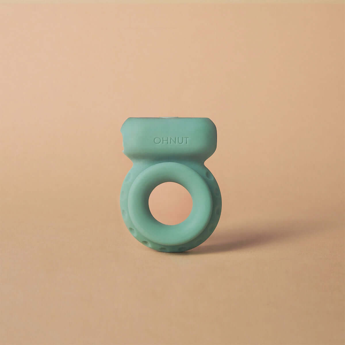 Ohnut Vibrating Ring Jade on a neutral background, showcasing its unique design and soft material.