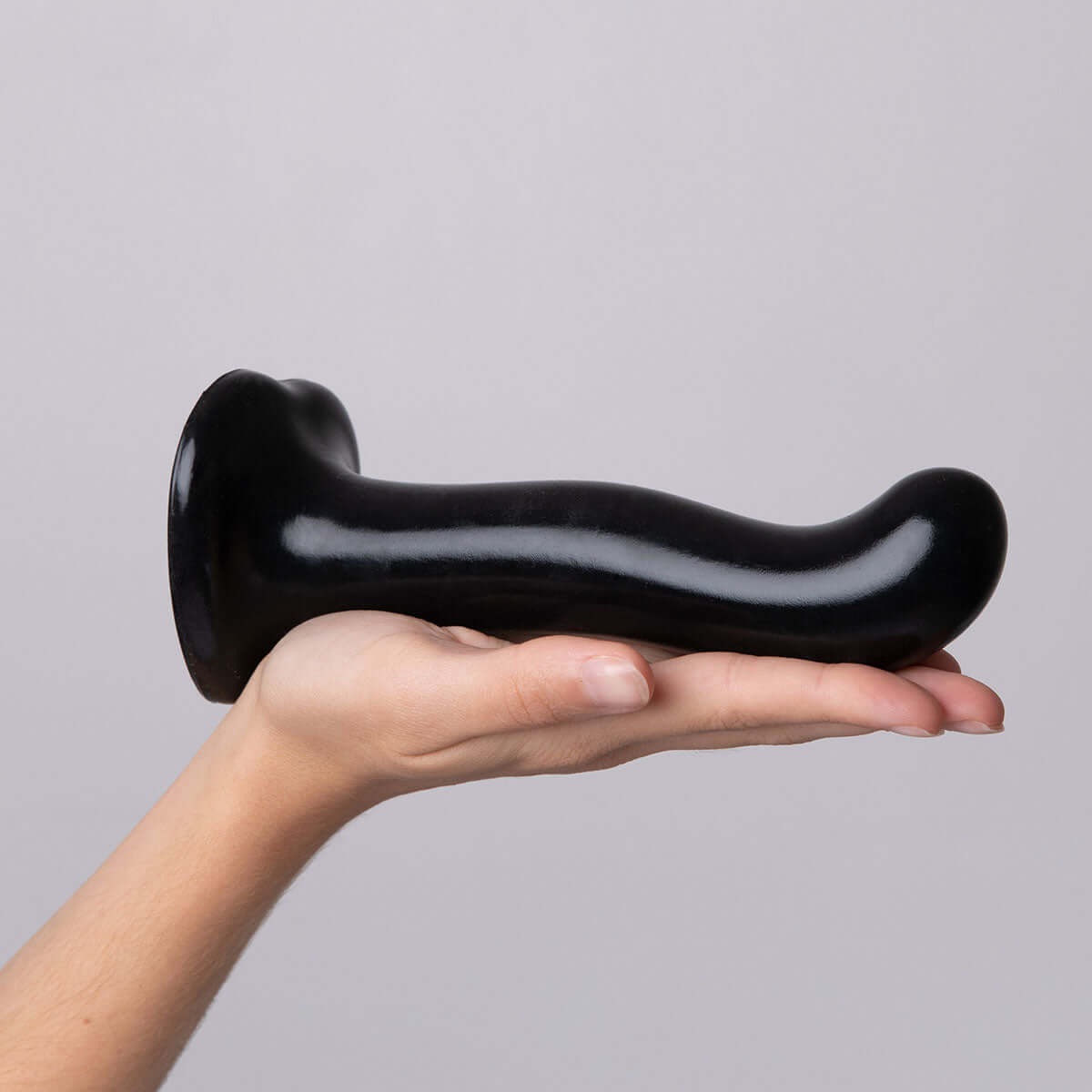 Strap-on-me P & G-spot Dildo Black Small held in hand, showcasing ergonomic design and body-safe silicone.