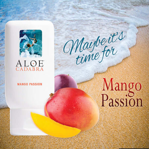 Aloe Cadabra Organic Lubricant Mango Passion 2.5 Oz with tropical fruits against a beach background.