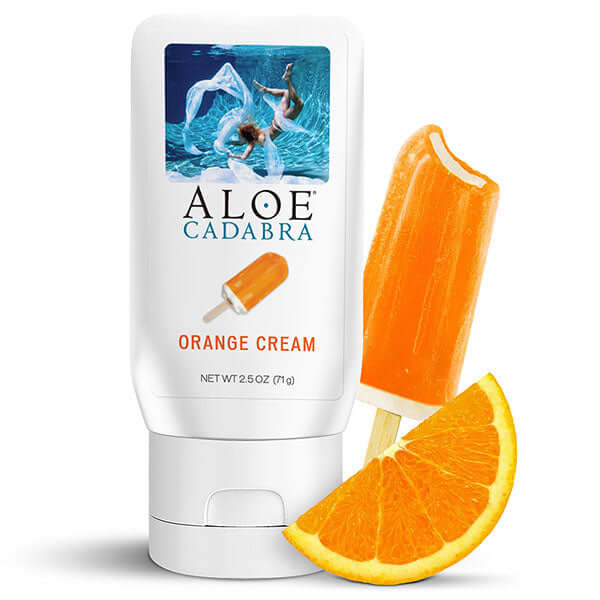 Aloe Cadabra Organic Lubricant Orange Cream 2.5 Oz with orange creamsicle and fresh orange slice.