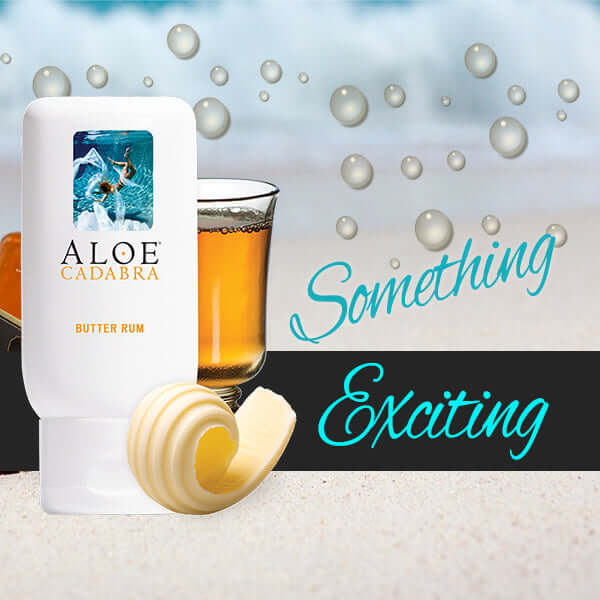 Aloe Cadabra Organic Lubricant Butter Rum 2.5 Oz with butter rum drink and creamy swirl on beach background