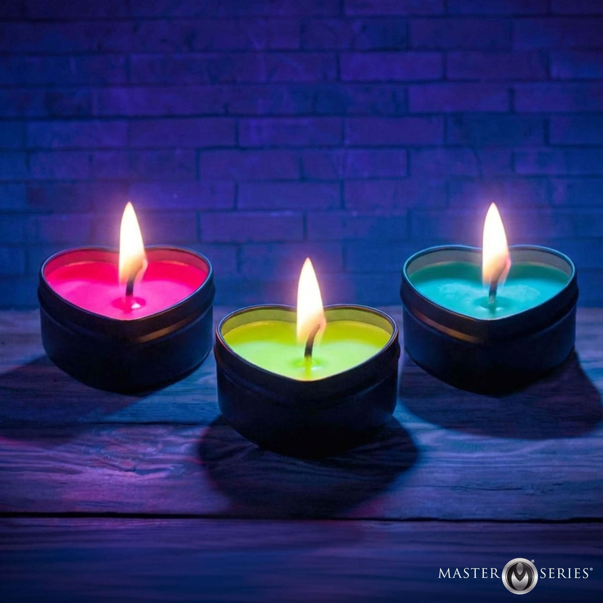 Burning Heart Blacklight Reactive Heart Drip Candle Set of 3 glowing heart-shaped candles in vibrant colors.