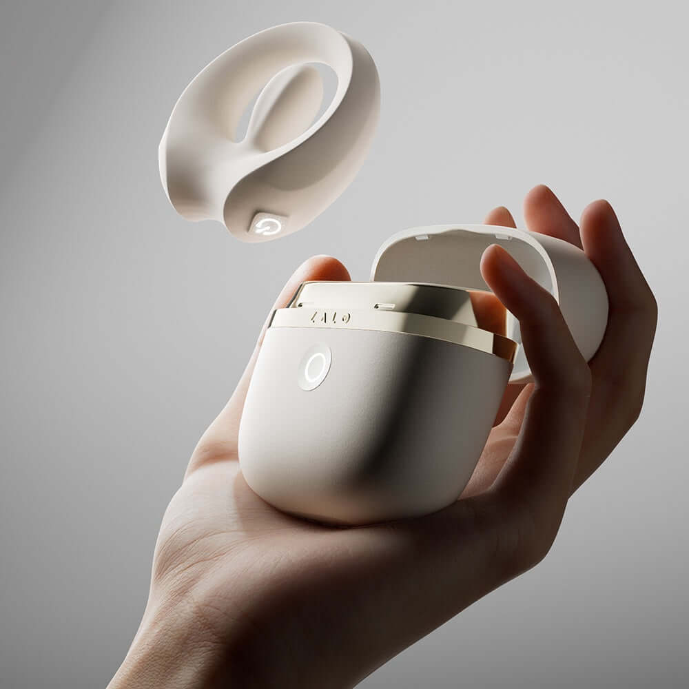 ZALO Apis Vibrating Couples Ring Ivory White showcased in an elegant hand, highlighting its premium design and compact form.