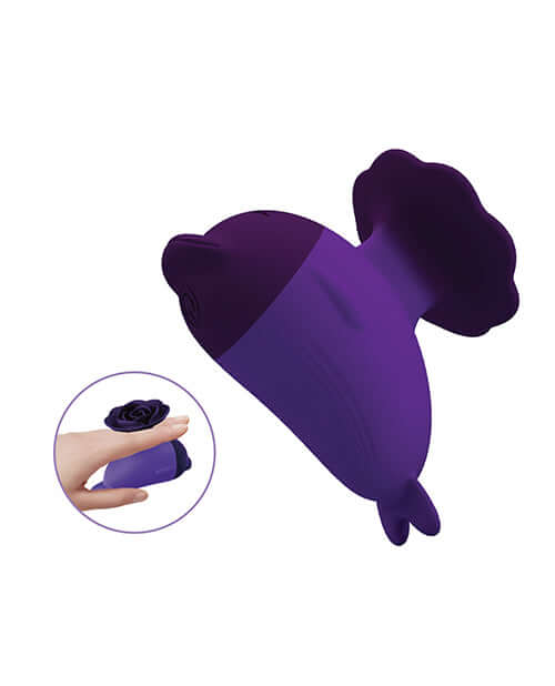 Pretty Love Dolphin Finger Vibe Purple shown in a hand, featuring a sleek and elegant design.