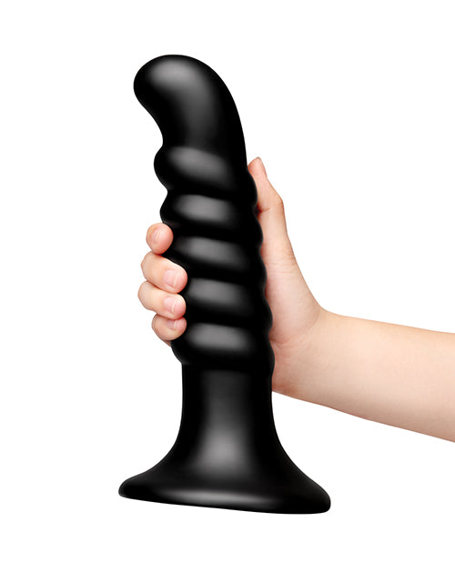 b-Vibe Krush 9.5 inch Curved & Ribbed Dildo Black held in hand showcasing its unique design and texture.