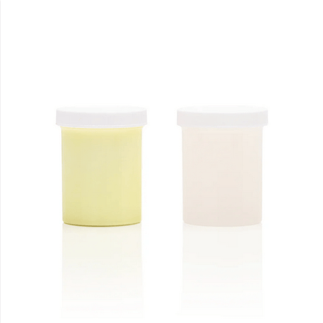 Clone-A-Willy Silicone Refill Glow In The Dark Green product containers, including a yellow and a clear jar.