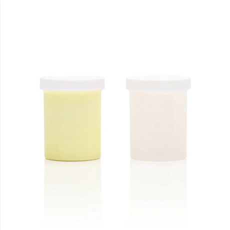 Clone-A-Willy Silicone Refill Glow In The Dark Green product containers, including a yellow and a clear jar.