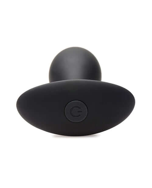 Rooster Rumbler Vibrating Silicone Anal Plug Large Black from a top view, showcasing its firm body and power button.