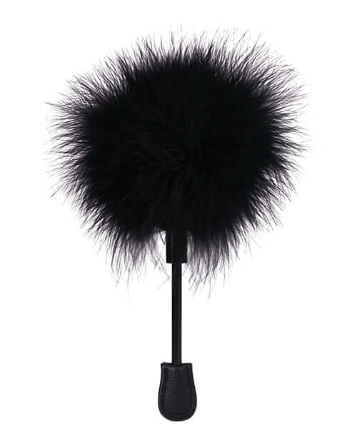 In A Bag Feather Tickler Black, a compact sensory toy with soft feathers for gentle stimulation.
