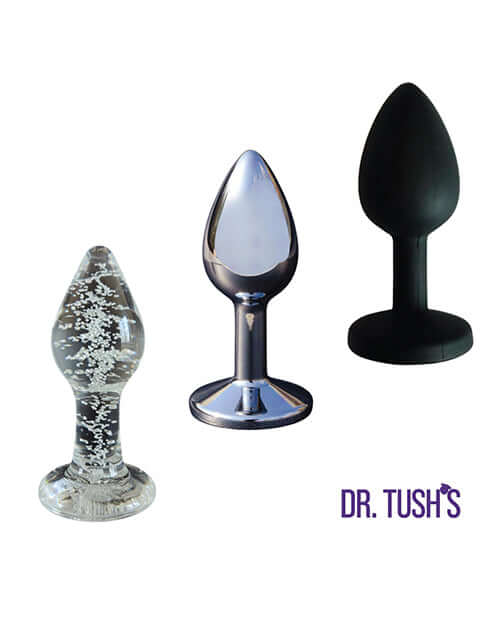 Dr Tush's First Step Anal Plug Set Glass Metal Silicone featuring three anal plugs in various materials and textures.