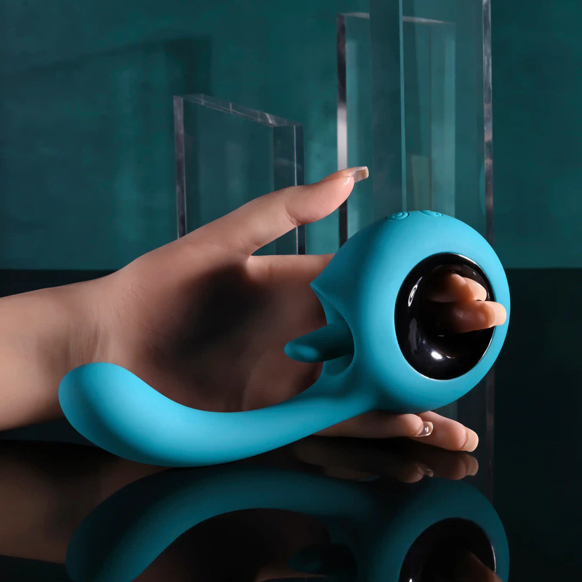 Evolved How Many Licks Silicone Vibrator Blue held in hand with a sleek design and soft silicone finish.