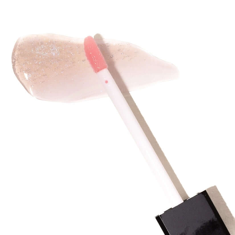 Eye Of Love Matchmaker Pheromone Lip Stain Pink Pulse with applicator and a swatch of glossy pink stain.