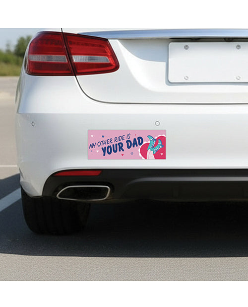 Sleazy Greetings Other Ride Is Your Dad Car Magnet displayed on a car bumper in a parking lot.