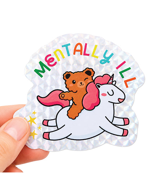 Mentally Ill Shiny Glitter Sticker featuring a cute teddy bear riding a unicorn with colorful lettering.