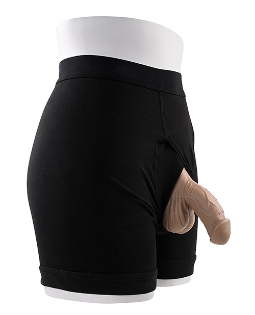 Gender X 4 inch Silicone Packer Tan displayed in black boxers, showcasing a realistic packing solution.